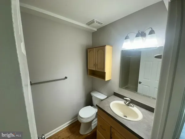 a bath tub sitting next to a white sink