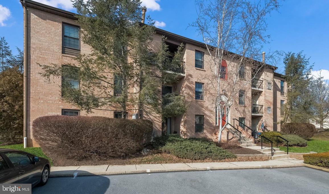 1430 Washington Place Chesterbrook, PA 19087 - Photo 3 of 44 a view of a brick house with a street