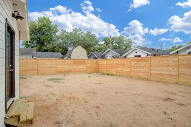 a view of a backyard of the house
