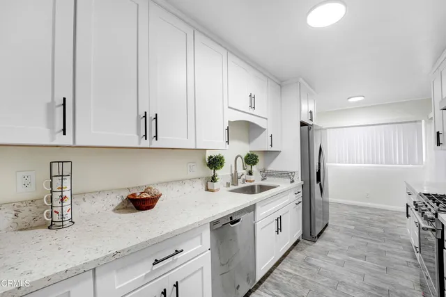 a kitchen with cabinets and window