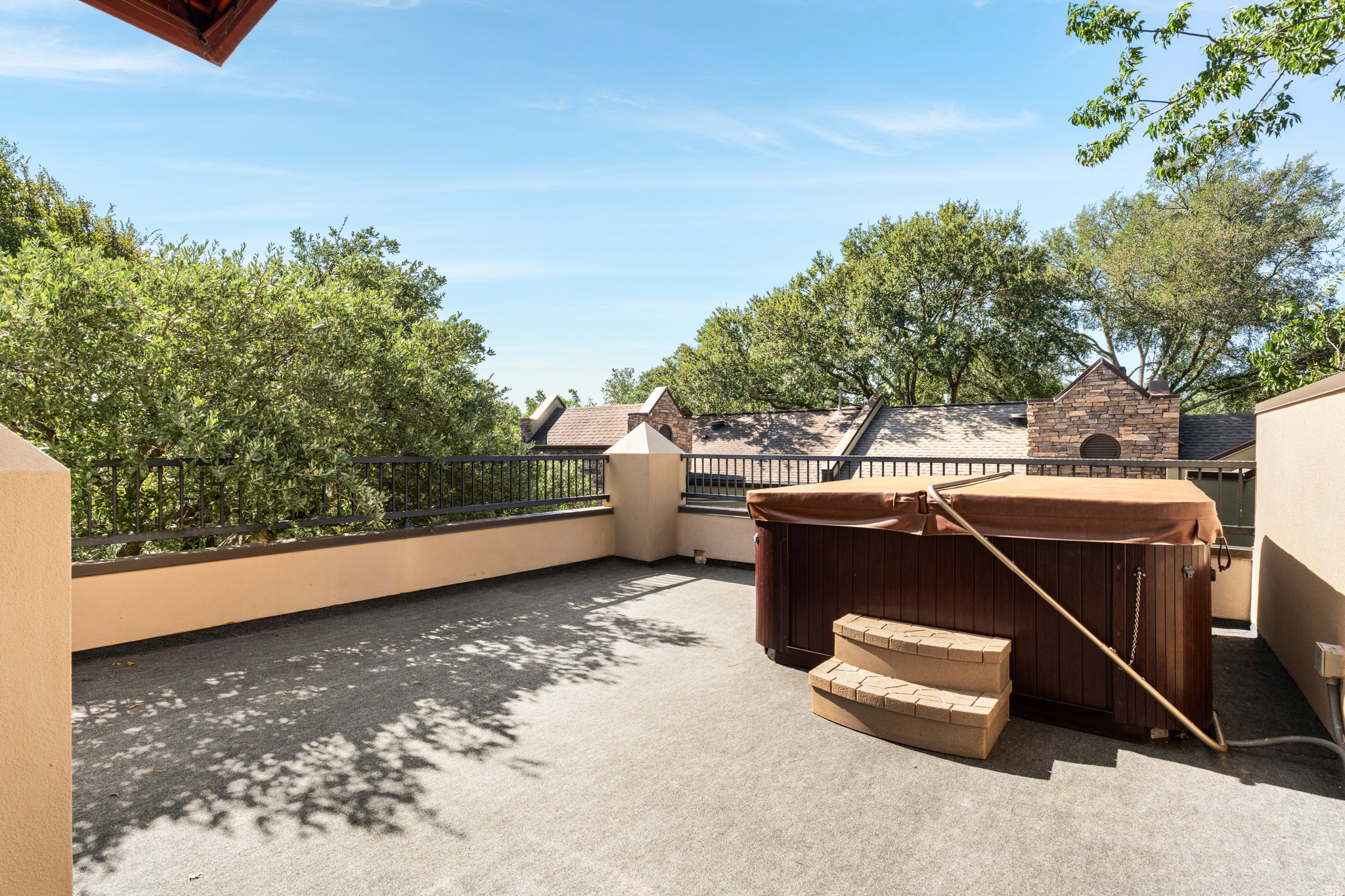 2324 Kinney Road Austin, TX 78704 - Photo 29 of 35 A spacious rooftop terrace boasts a private hot tub surrounded by mature trees.