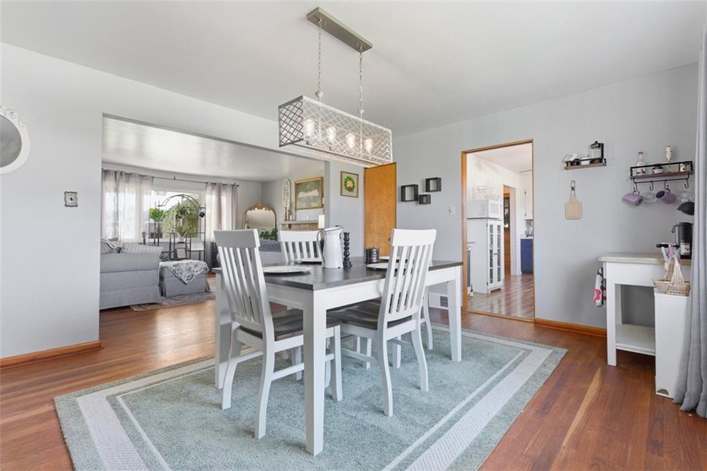 2354 Ritchie Street Aliquippa, PA 15001 - Photo 12 of 43 a dining room with furniture a chandelier and wooden floor