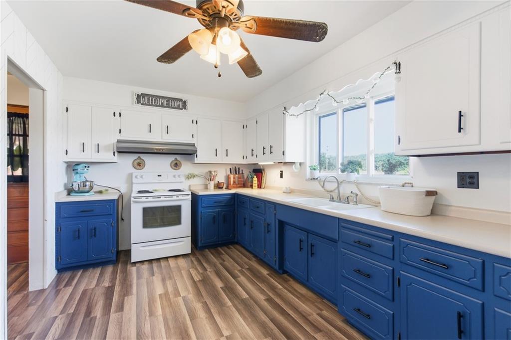 2354 Ritchie Street Aliquippa, PA 15001 - Photo 14 of 43 a kitchen with stainless steel appliances granite countertop a sink a stove and cabinets