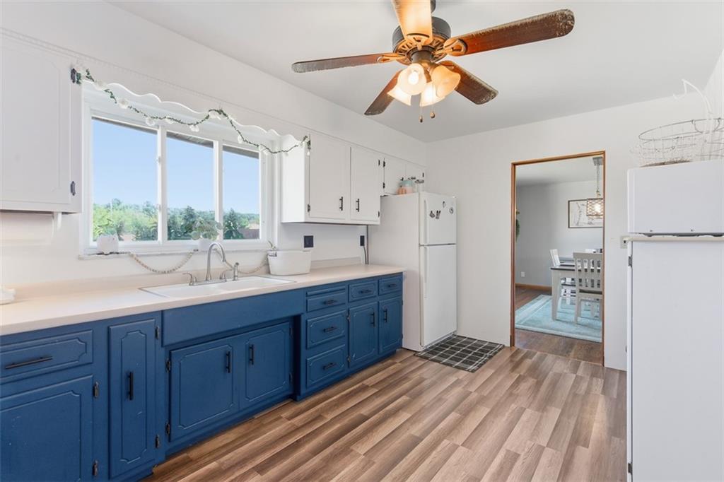 2354 Ritchie Street Aliquippa, PA 15001 - Photo 15 of 43 a kitchen with wooden floors and a sink