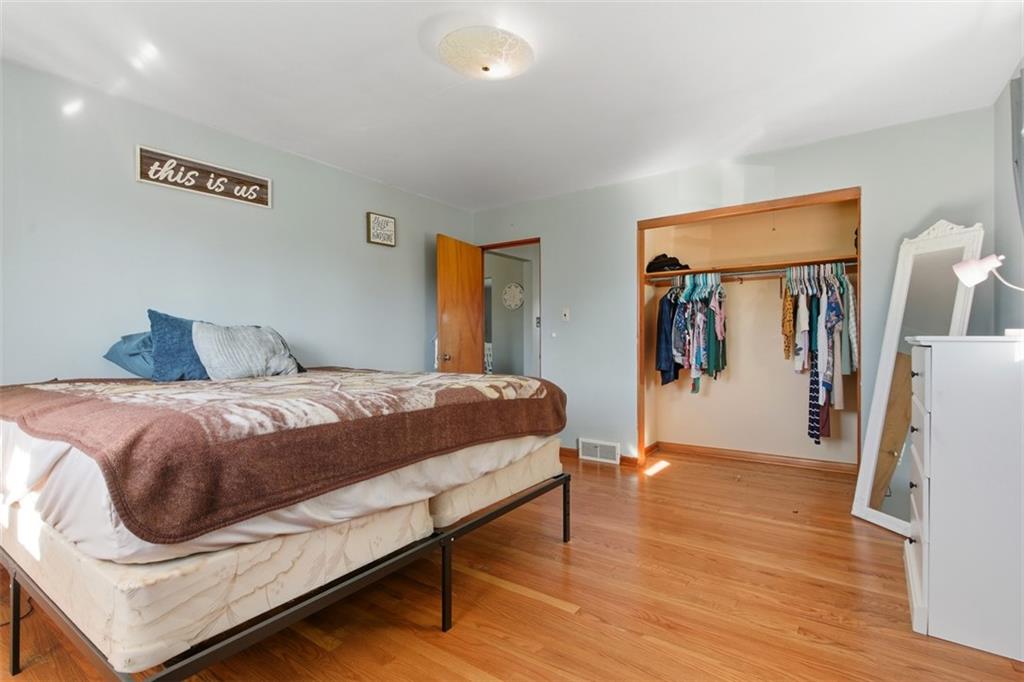 2354 Ritchie Street Aliquippa, PA 15001 - Photo 19 of 43 a bedroom with a bed and a flat screen tv