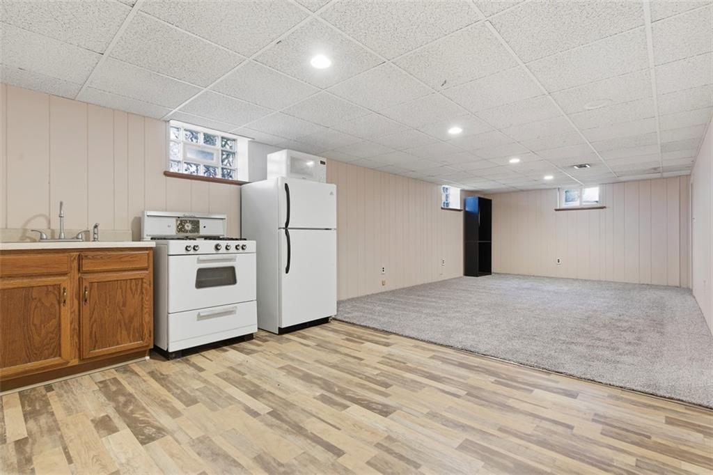 2354 Ritchie Street Aliquippa, PA 15001 - Photo 26 of 43 a view of a kitchen with a stove cabinets and wooden floor