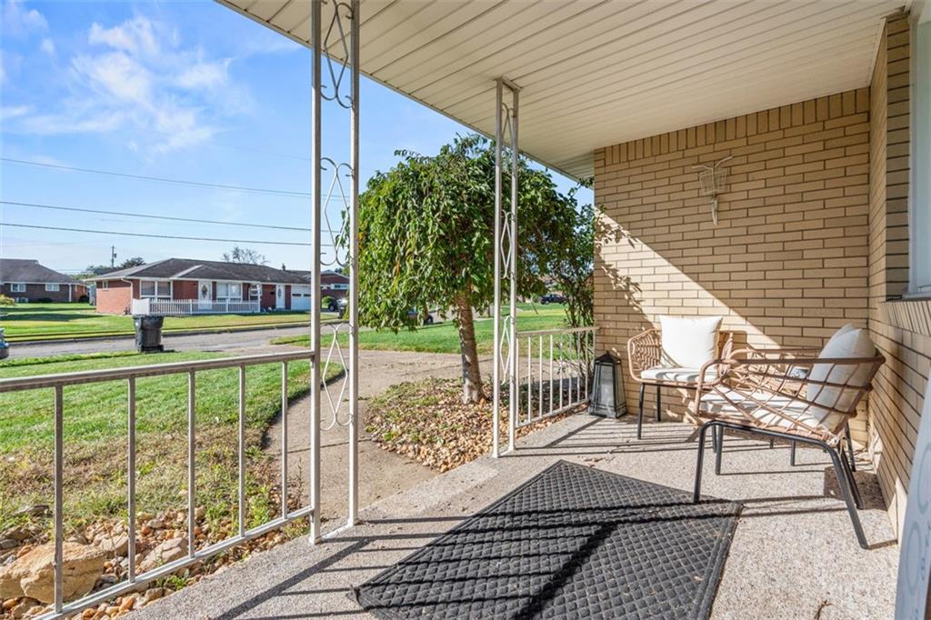 2354 Ritchie Street Aliquippa, PA 15001 - Photo 4 of 43 a view of a chair and tables in the back yard of the house