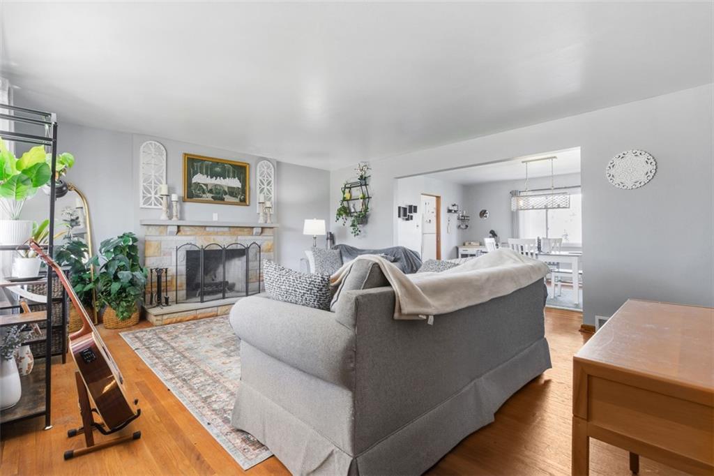2354 Ritchie Street Aliquippa, PA 15001 - Photo 6 of 43 a living room with furniture a fireplace and a flat screen tv