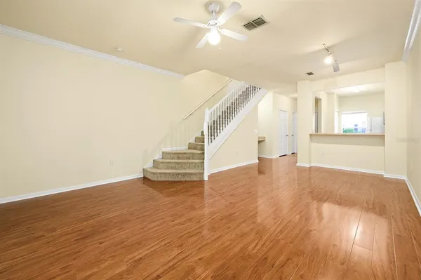 a view of an entryway with wooden floor