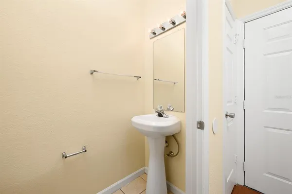 a view of a hallway with bathroom and shower