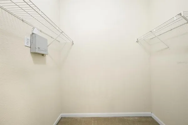 a bathroom with a double vanity sink mirror and toilet