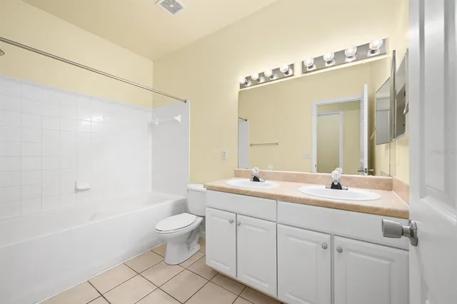 a view of a hallway with wooden floor and entryway