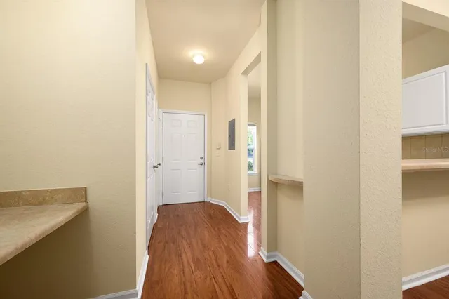 a view of an entryway with wooden floor