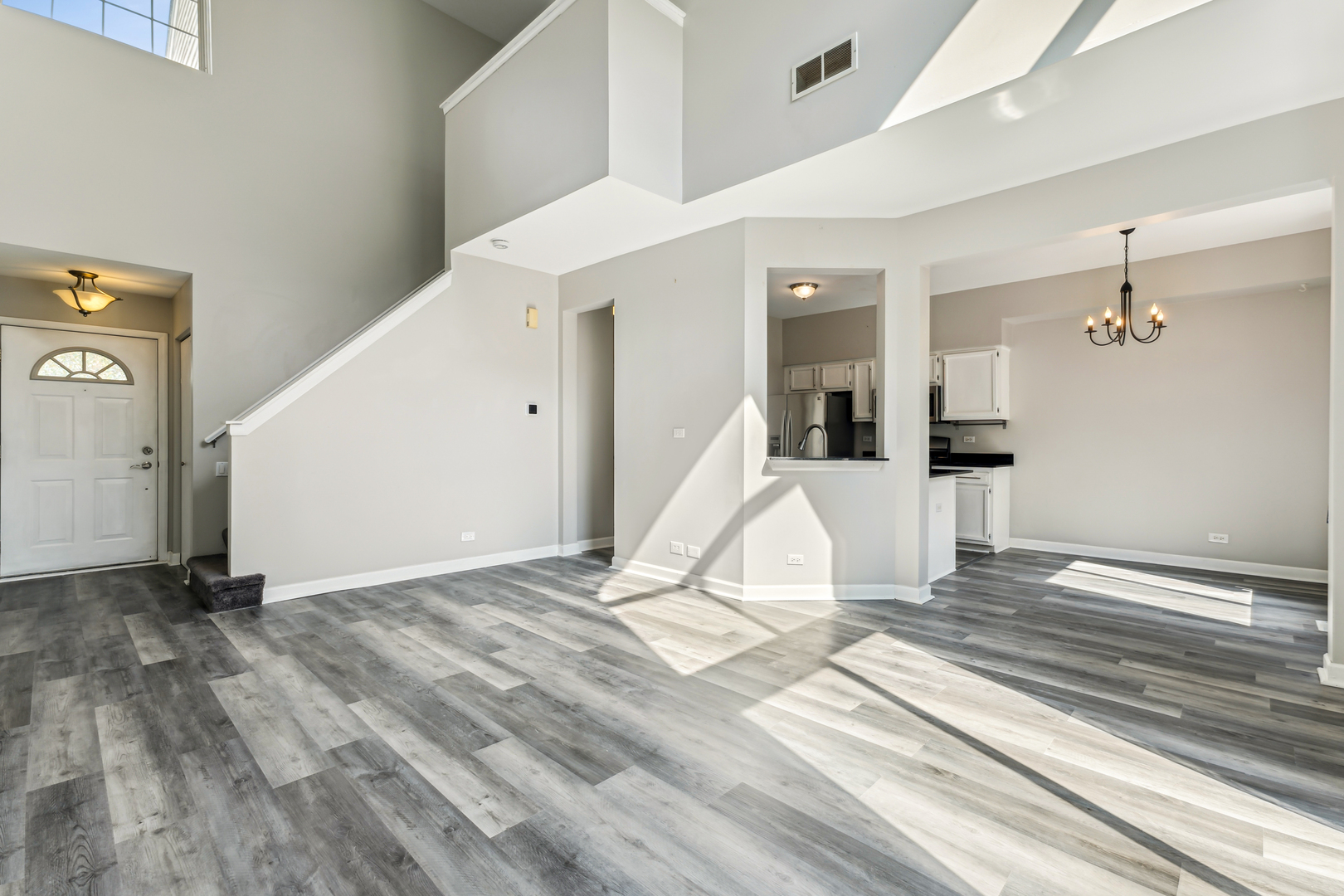 1697 Spaulding Road Bartlett, IL 60103 - Photo 2 of 2 a view of a livingroom with wooden floor and white walls