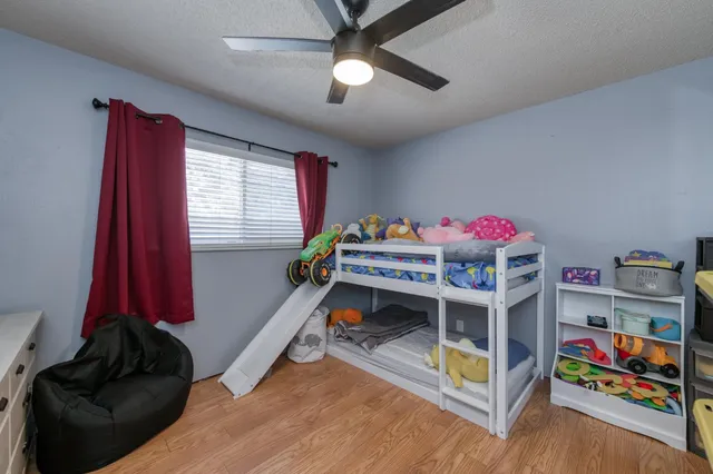 a bedroom with furniture and a window