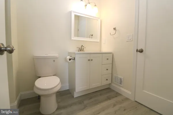 a bathroom with a toilet a sink and bathtub