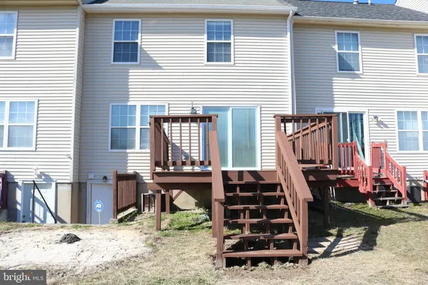 a view of a balcony with wooden floor