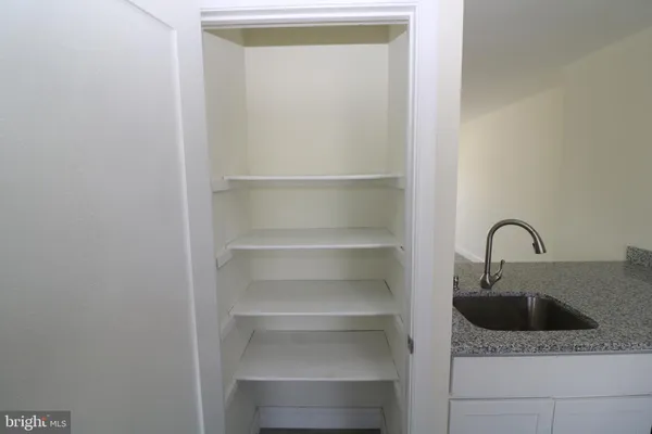 a kitchen with a sink and a refrigerator