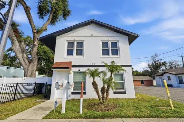 a front view of a house with a yard