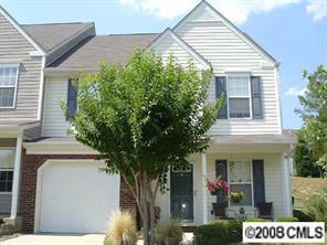 445 Robin Reed Court Pineville, NC 28134 - Photo 1 of 8 a view of a house with potted plants and a tree