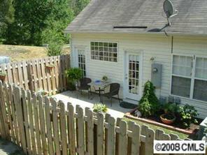 445 Robin Reed Court Pineville, NC 28134 - Photo 2 of 8 a view of a house with a wooden fence