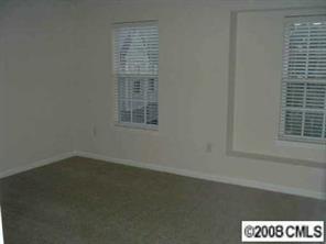 445 Robin Reed Court Pineville, NC 28134 - Photo 7 of 8 an empty room with a window