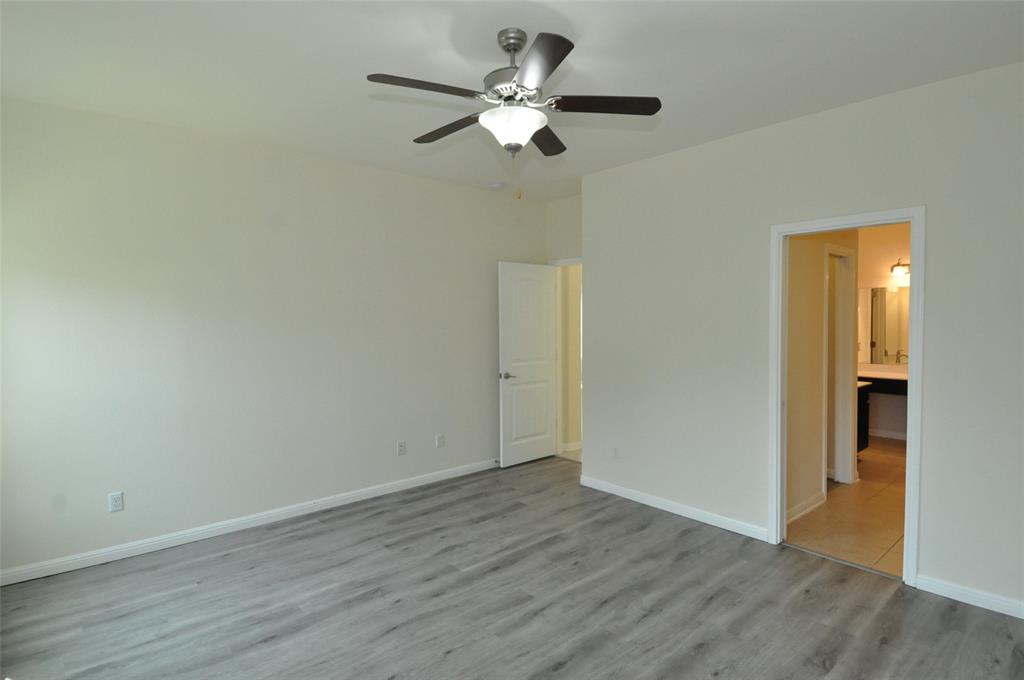 3451 Mayfield Ranch Boulevard, Unit 610 Round Rock, TX 78681 - Photo 10 of 19 Unfurnished bedroom with light wood finished floors and ceiling fan