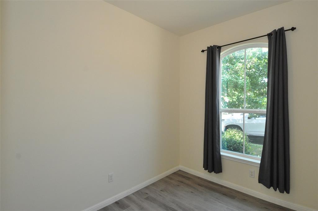3451 Mayfield Ranch Boulevard, Unit 610 Round Rock, TX 78681 - Photo 14 of 19 Empty room featuring baseboards and light wood-style floors