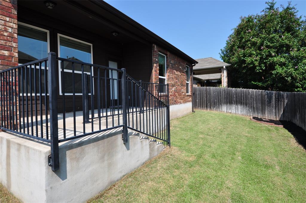 3451 Mayfield Ranch Boulevard, Unit 610 Round Rock, TX 78681 - Photo 18 of 19 View of yard featuring a patio