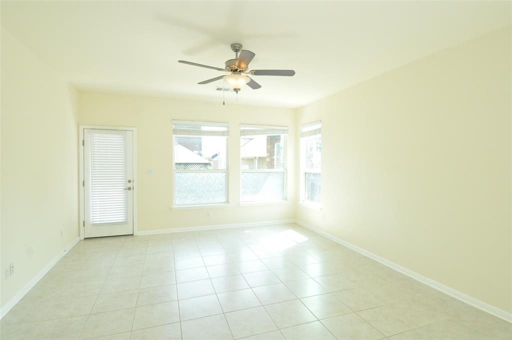 3451 Mayfield Ranch Boulevard, Unit 610 Round Rock, TX 78681 - Photo 6 of 19 Empty room with ceiling fan and light tile patterned flooring