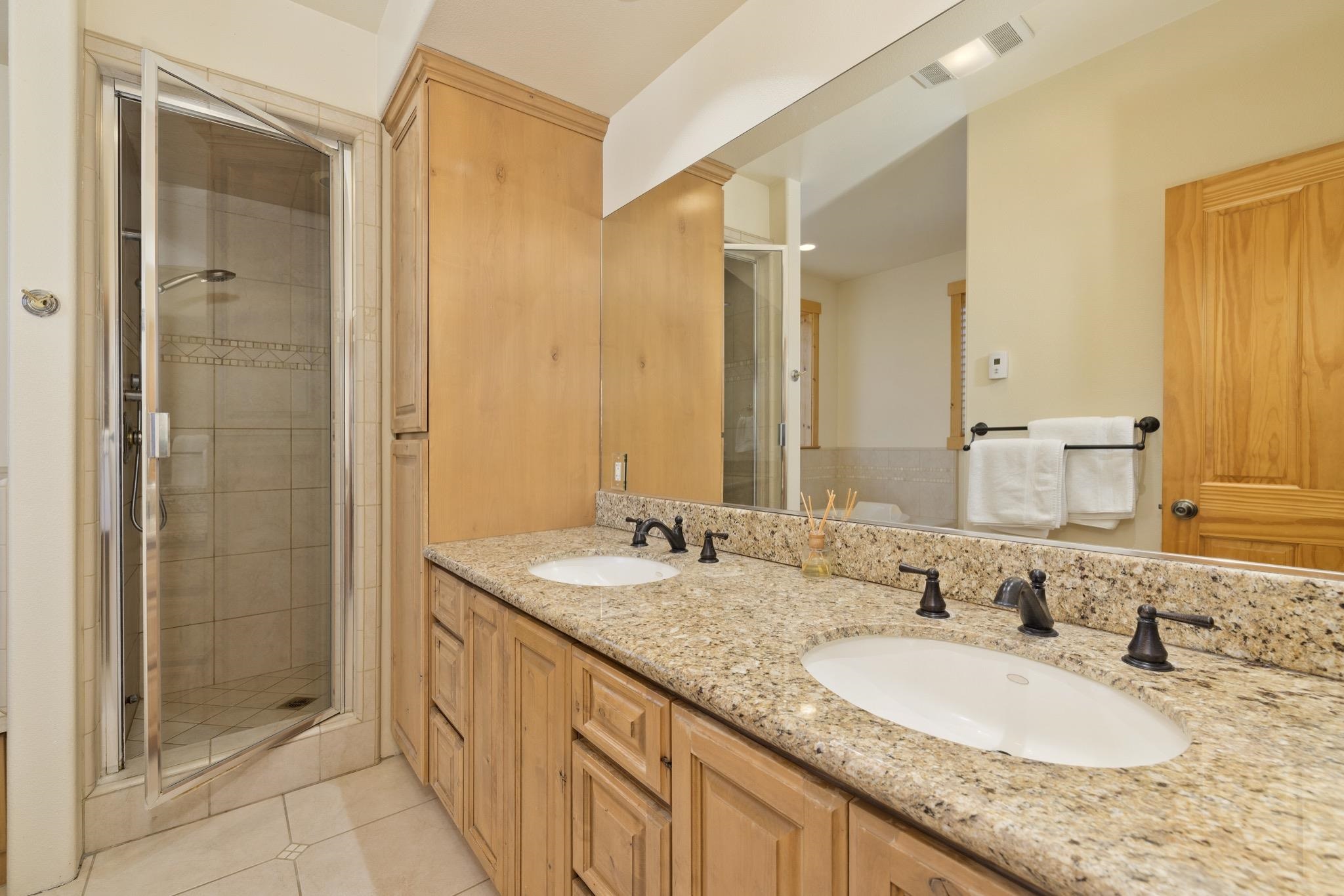 23 Trails End Road Mammoth Lakes, CA 93546 - Photo 13 of 50 a bathroom with a granite countertop double vanity sink and a mirror