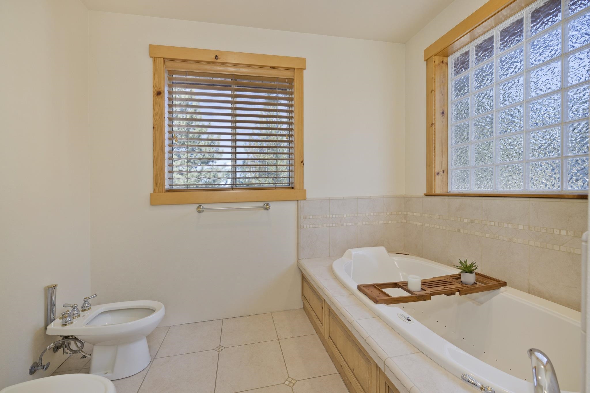 23 Trails End Road Mammoth Lakes, CA 93546 - Photo 14 of 50 a bathroom with a sink a toilet and a window