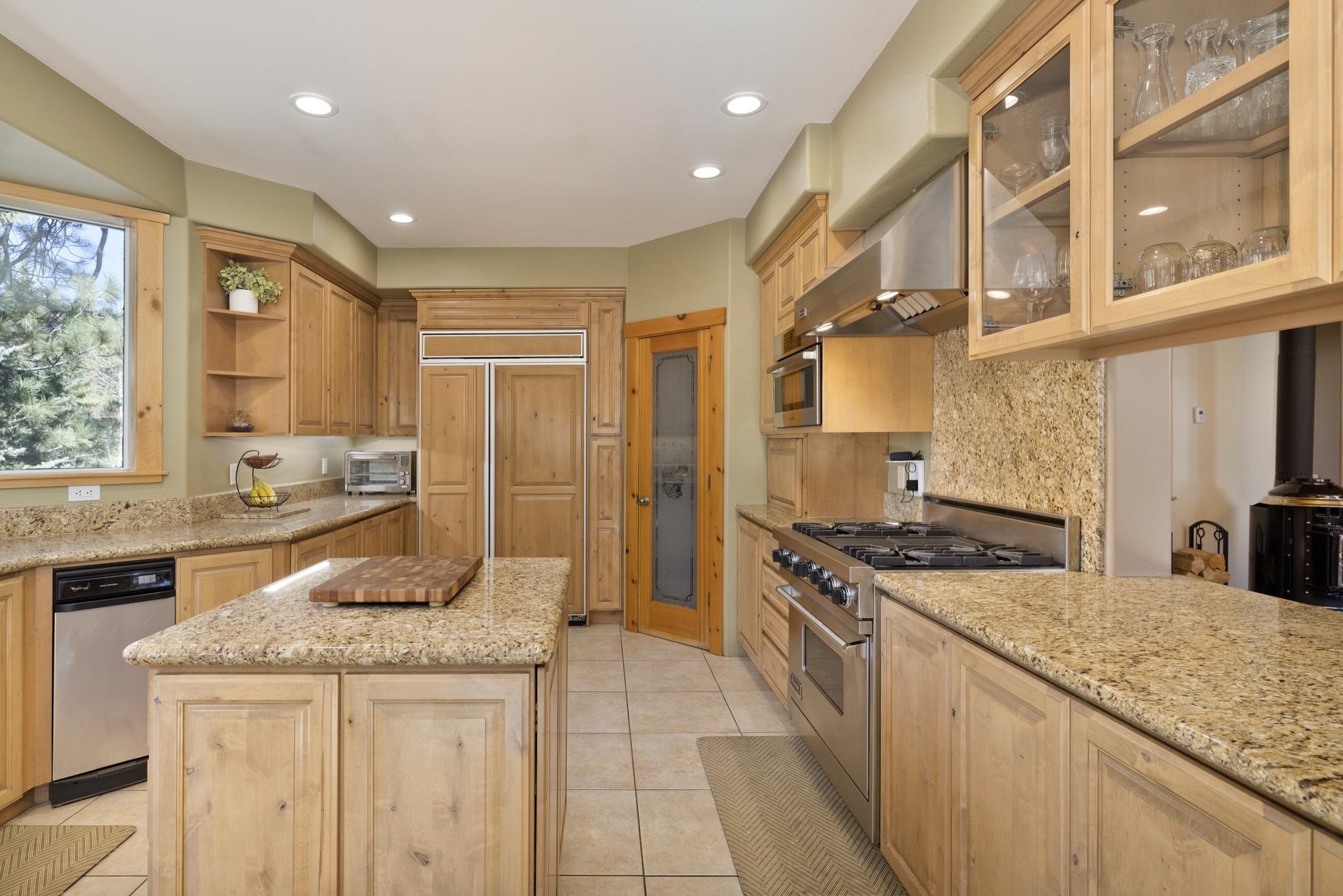 23 Trails End Road Mammoth Lakes, CA 93546 - Photo 32 of 50 a kitchen with stainless steel appliances granite countertop a stove and a refrigerator