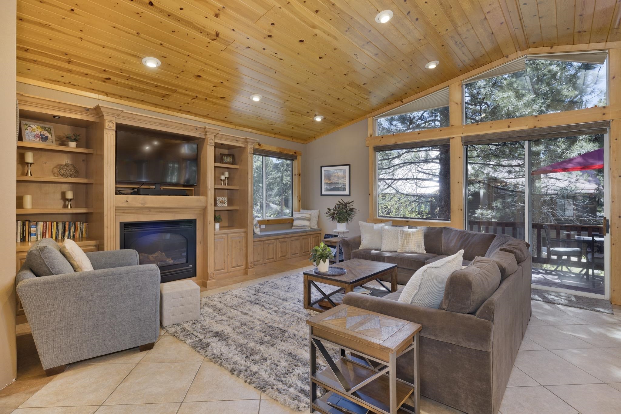 23 Trails End Road Mammoth Lakes, CA 93546 - Photo 38 of 50 a living room with fireplace furniture and a flat screen tv