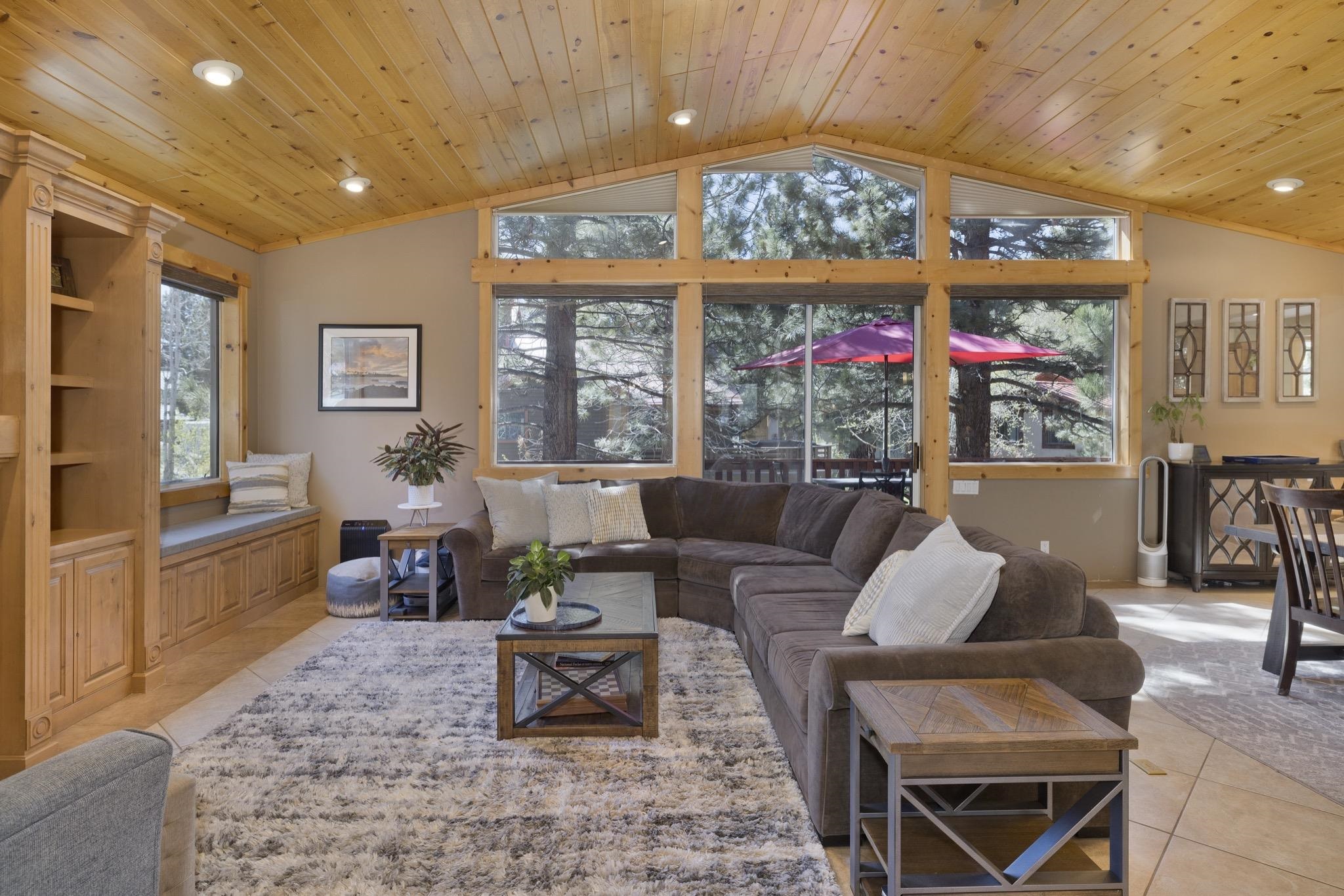 23 Trails End Road Mammoth Lakes, CA 93546 - Photo 39 of 50 a living room with furniture a rug and a floor to ceiling window