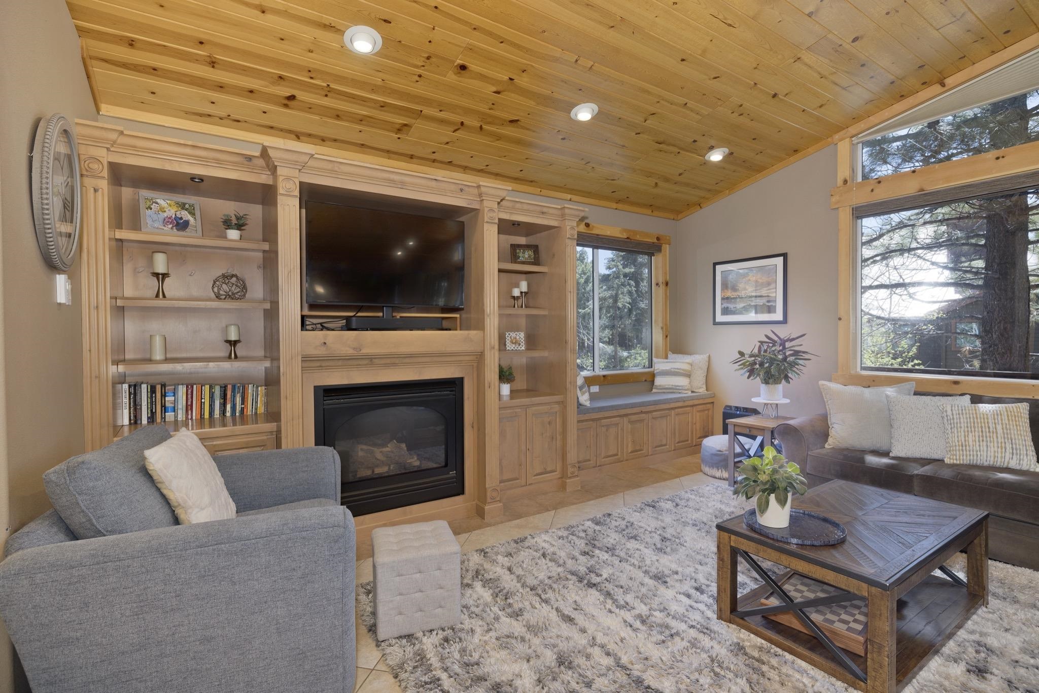 23 Trails End Road Mammoth Lakes, CA 93546 - Photo 40 of 50 a living room with furniture a flat screen tv and a fireplace