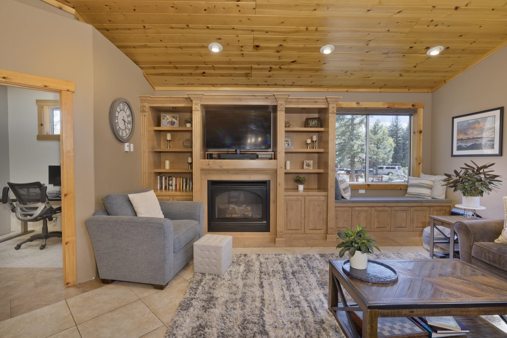 23 Trails End Road Mammoth Lakes, CA 93546 - Photo 42 of 50 a living room with furniture a fireplace and a flat screen tv