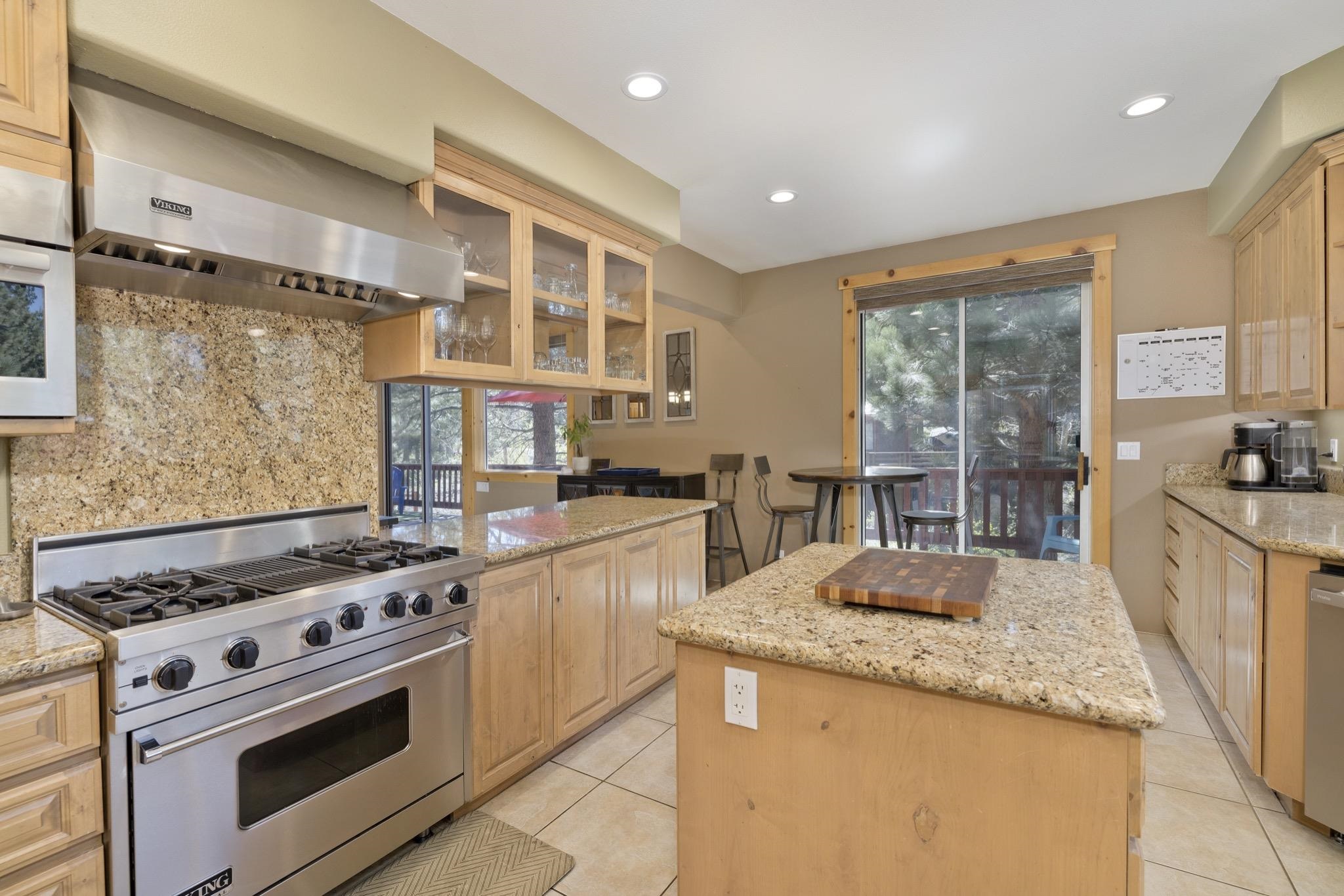 23 Trails End Road Mammoth Lakes, CA 93546 - Photo 6 of 50 a kitchen with granite countertop a sink stove and cabinets
