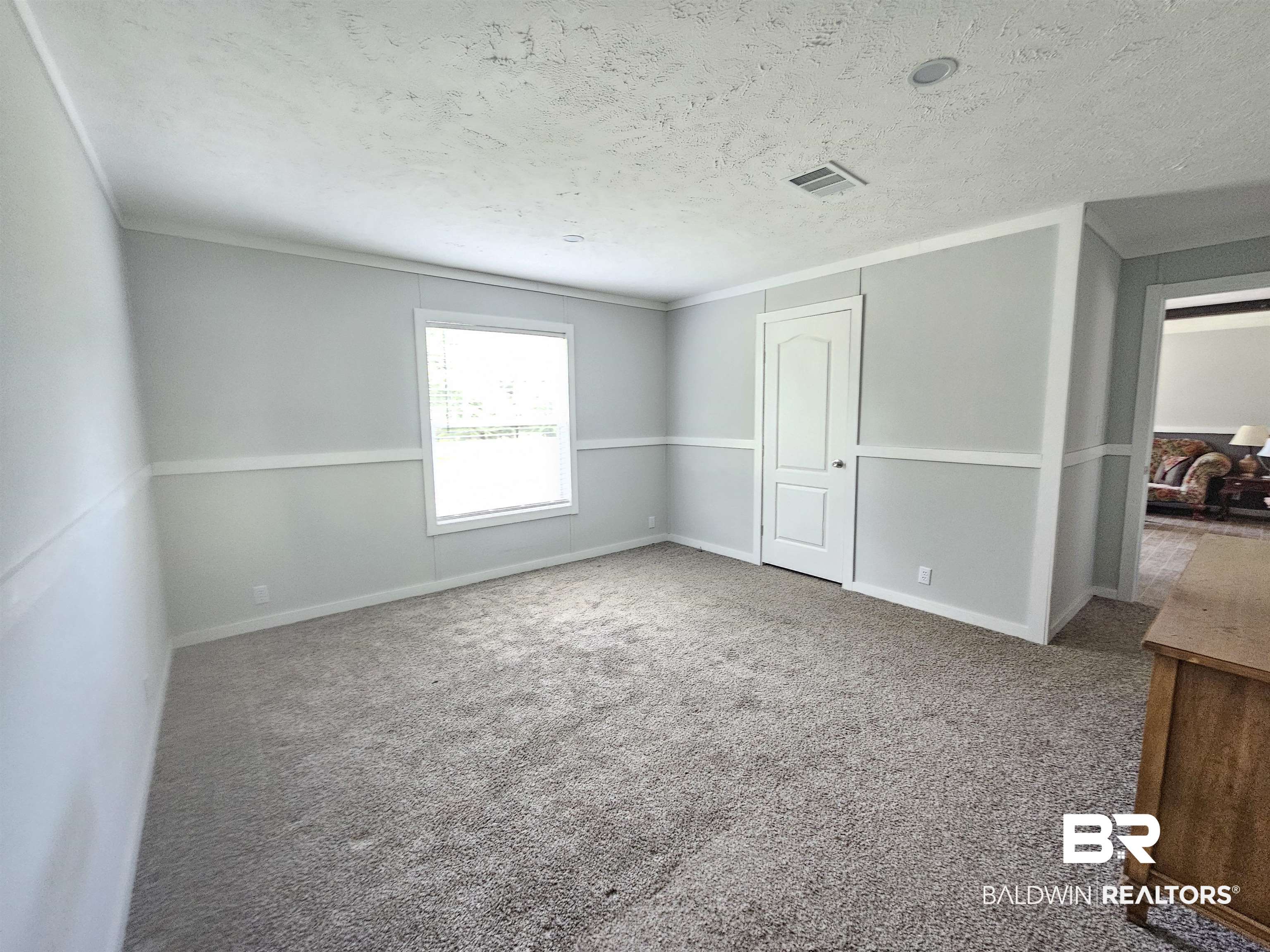 1863 Wait Road Monroeville, AL 36460 - Photo 10 of 38 Carpeted empty room with a textured ceiling