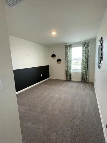 a view of a livingroom with a & a window