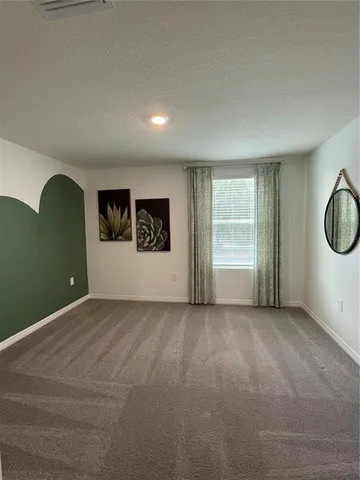 a bathroom with a double vanity sink and mirror