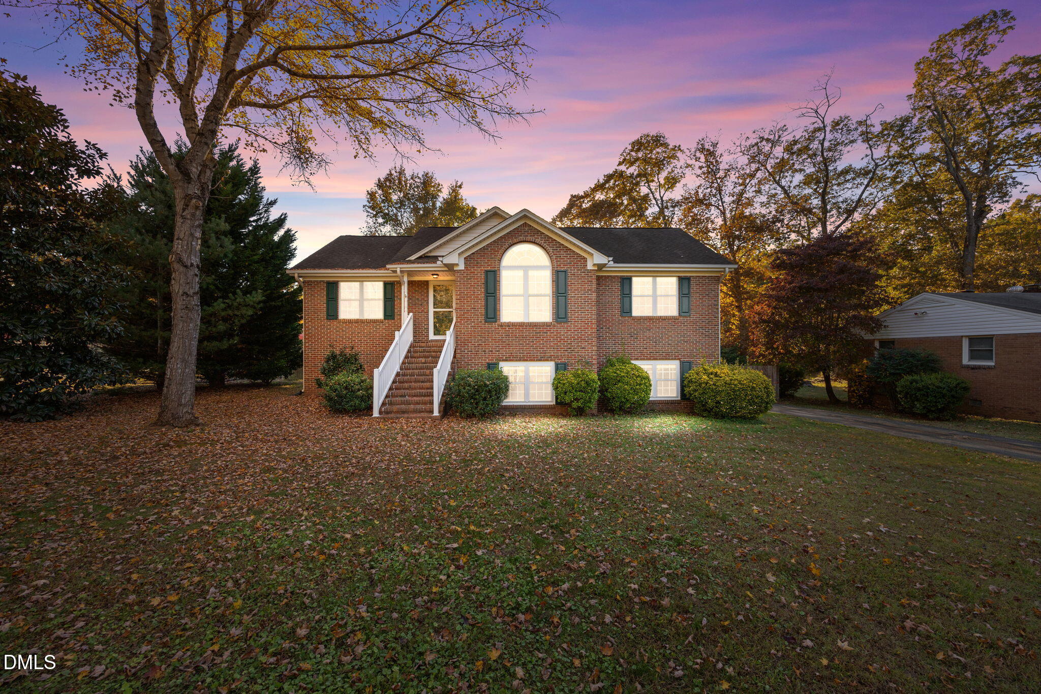 2267 South Jim Minor Road Haw River, NC 27258 - Photo 1 of 36 a front view of a house with a yard and garage
