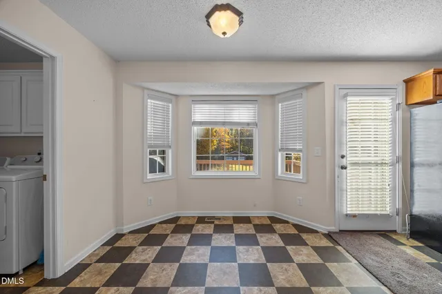 a kitchen with stainless steel appliances a stove sink microwave and cabinets
