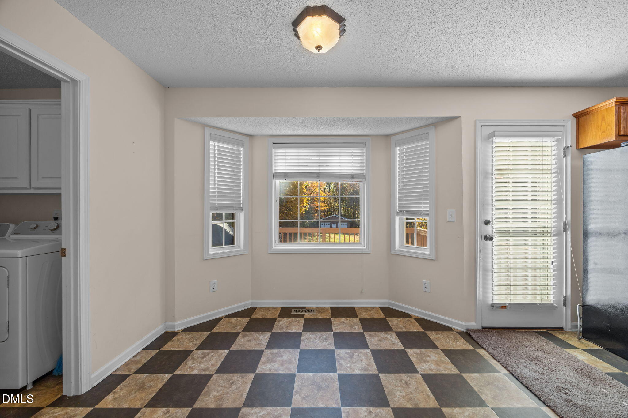 2267 South Jim Minor Road Haw River, NC 27258 - Photo 12 of 36 a black and white checkered floor with a black white checkered floor next to a window