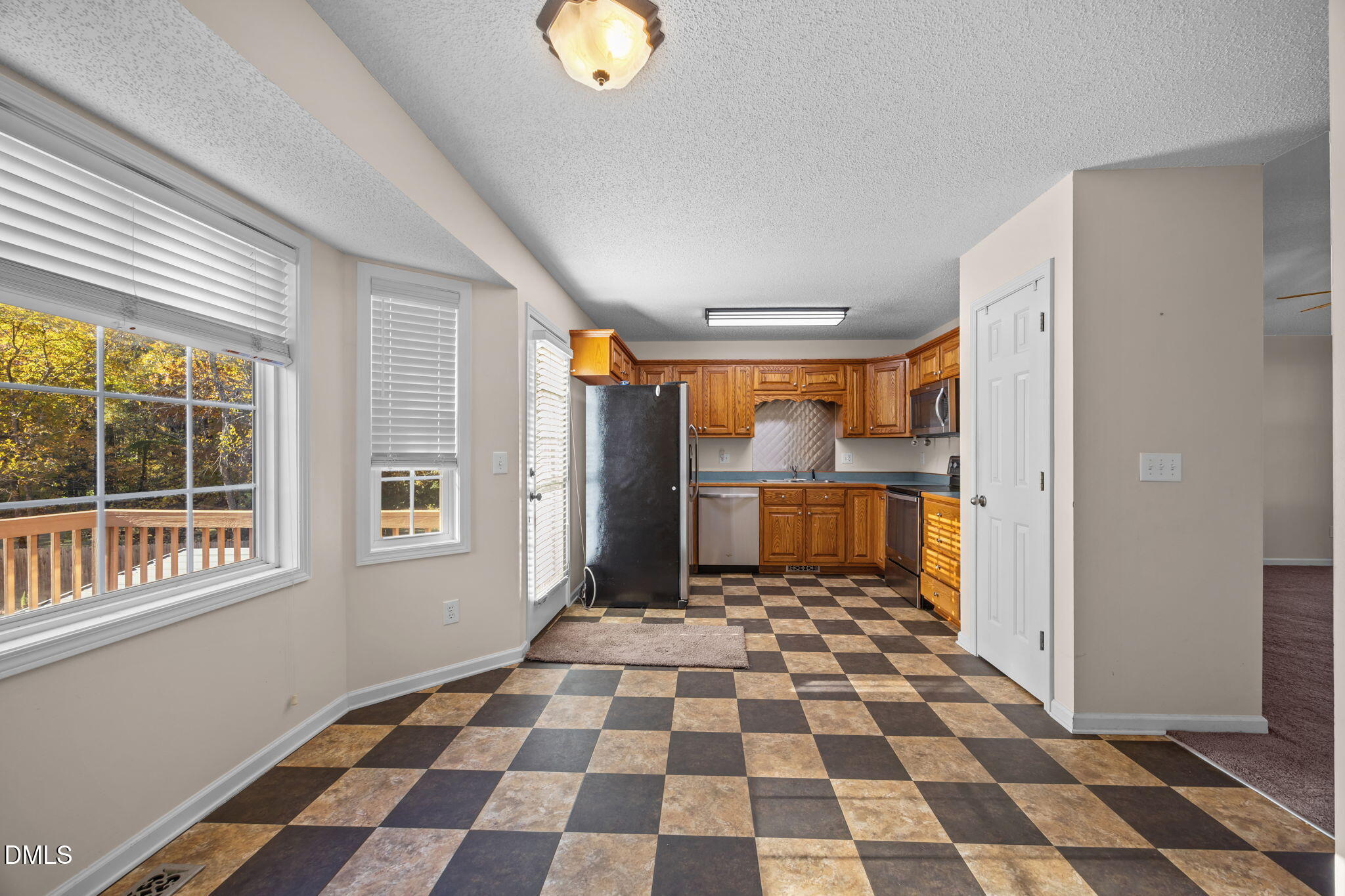 2267 South Jim Minor Road Haw River, NC 27258 - Photo 13 of 36 a bathroom with a black white checkered floor with a black white checkered floor