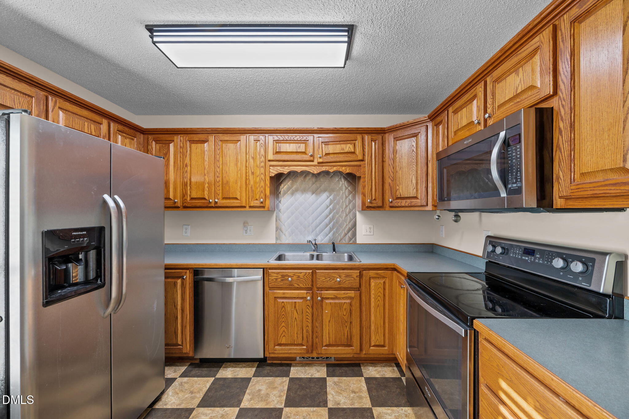 2267 South Jim Minor Road Haw River, NC 27258 - Photo 15 of 36 a kitchen with stainless steel appliances granite countertop a refrigerator a stove and a sink