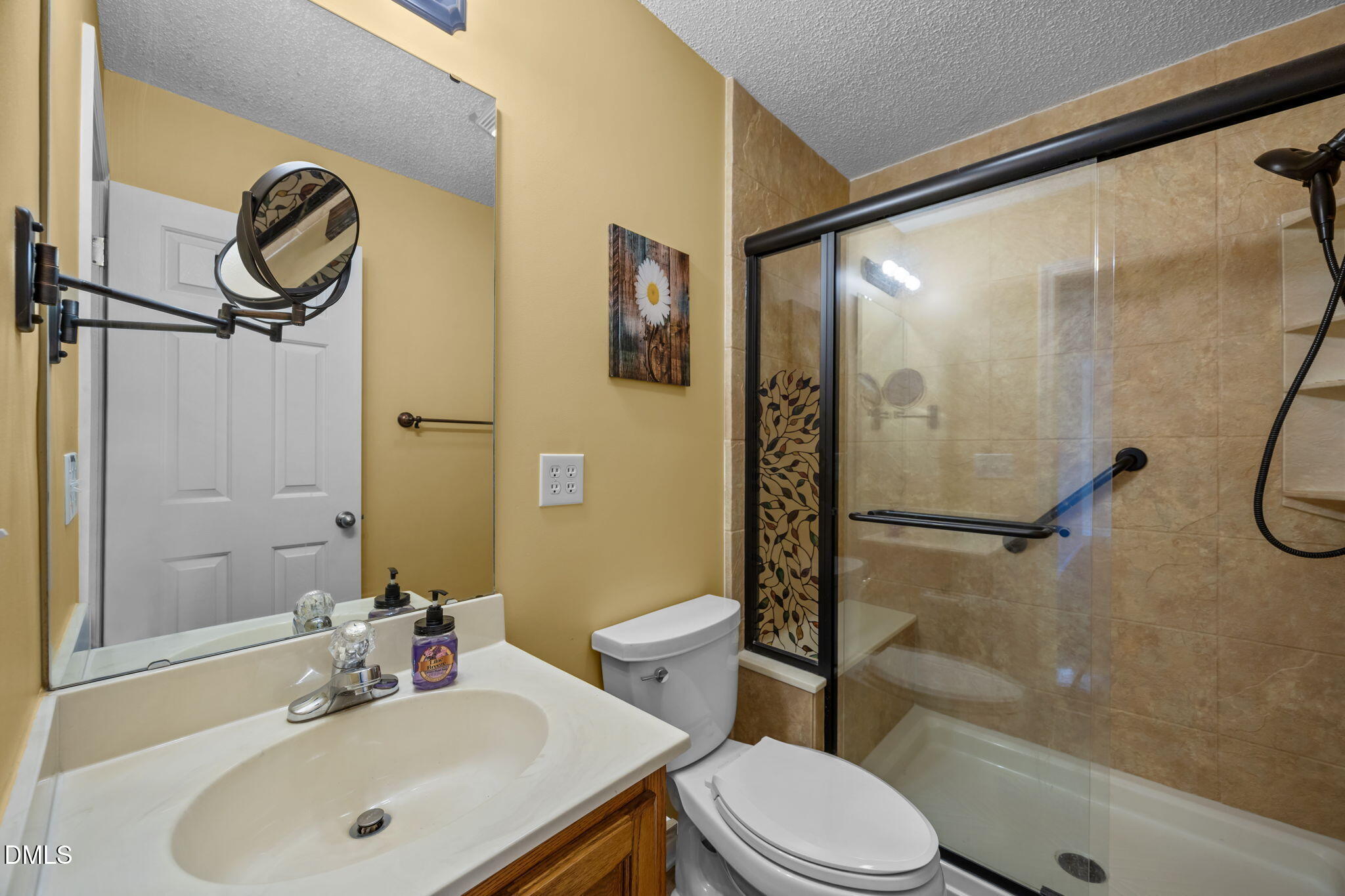 2267 South Jim Minor Road Haw River, NC 27258 - Photo 17 of 36 a bathroom with a sink toilet and shower