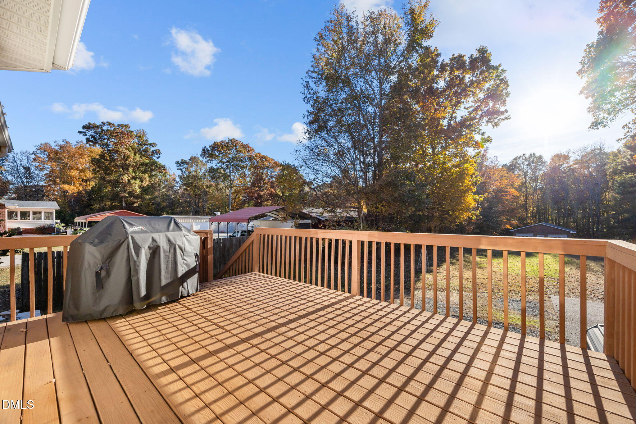 2267 South Jim Minor Road Haw River, NC 27258 - Photo 34 of 36 a view of balcony with wooden floor and fence and trees