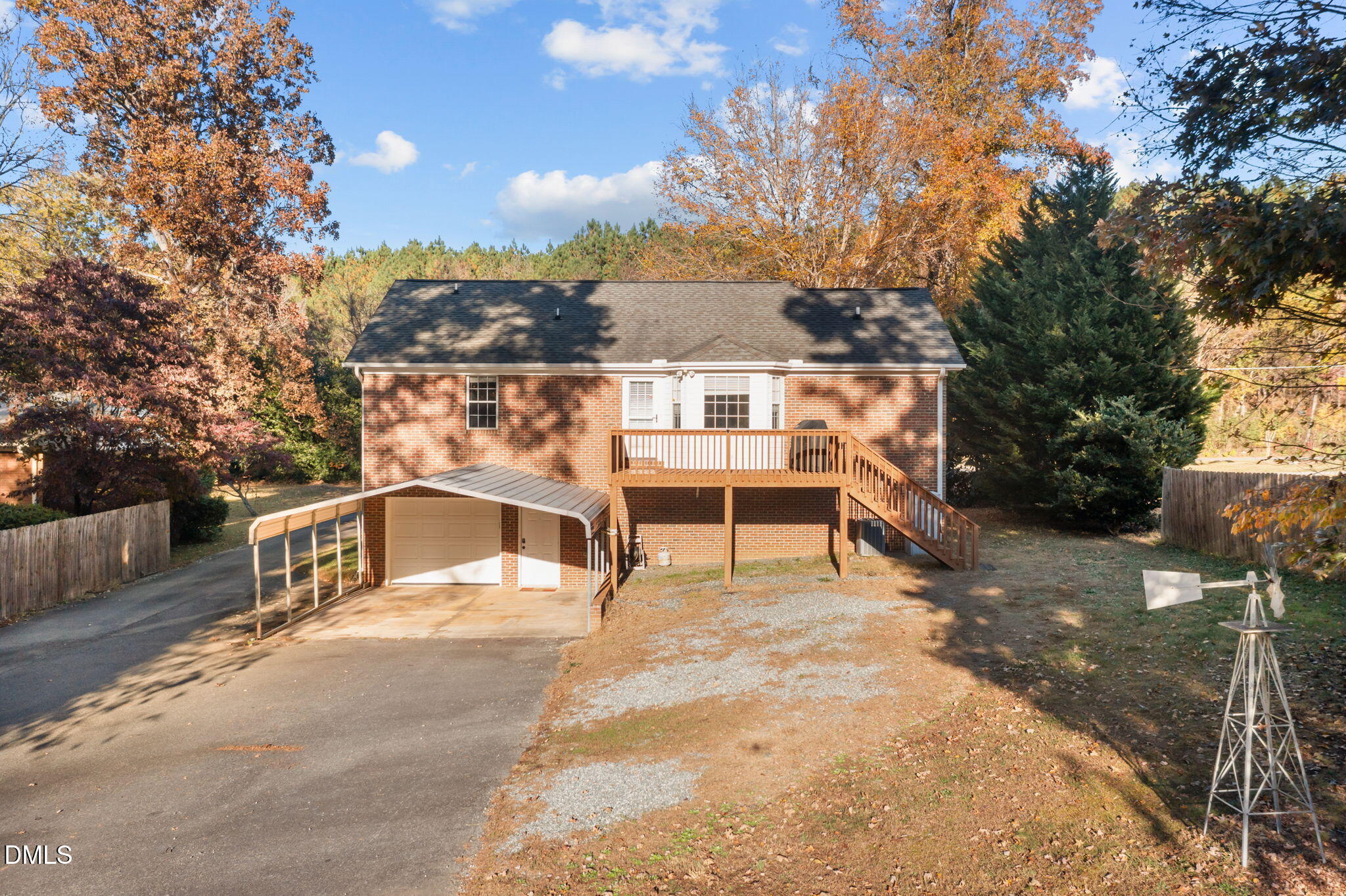 2267 South Jim Minor Road Haw River, NC 27258 - Photo 4 of 36 a house with trees in front of it