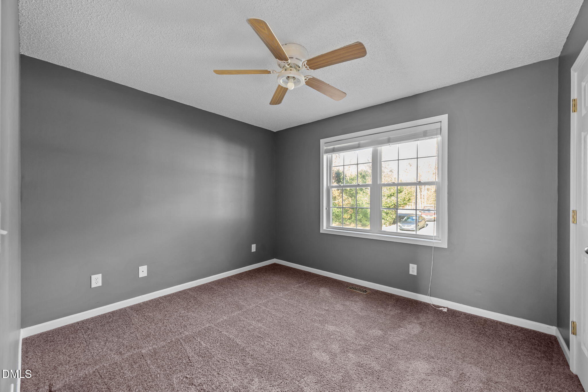 2267 South Jim Minor Road Haw River, NC 27258 - Photo 5 of 36 an empty room with a ceiling fan and window